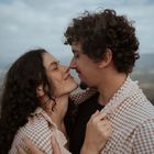Portrait of a smiling woman with a natural background.