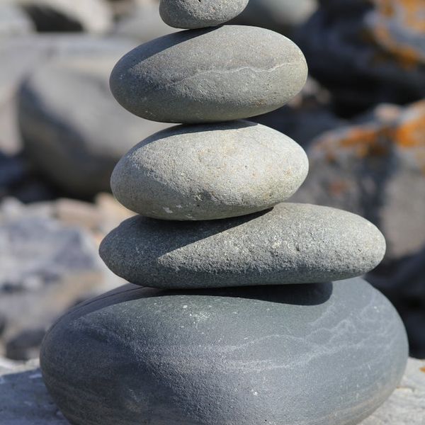 Smooth stones stacked on top of each other in perfect balance.